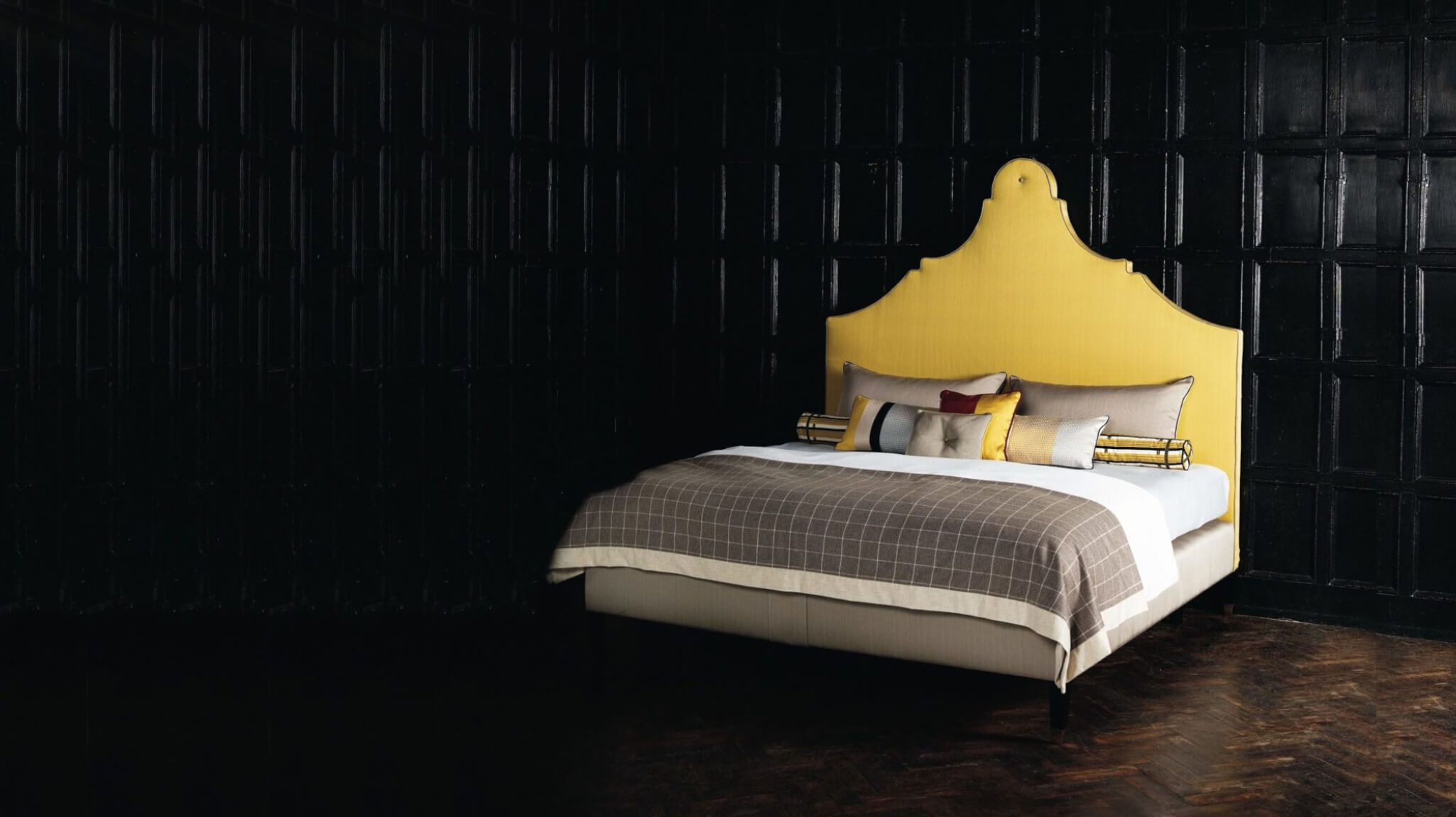 Bold, yellow Claudia headboard featuring a Rococo shape.