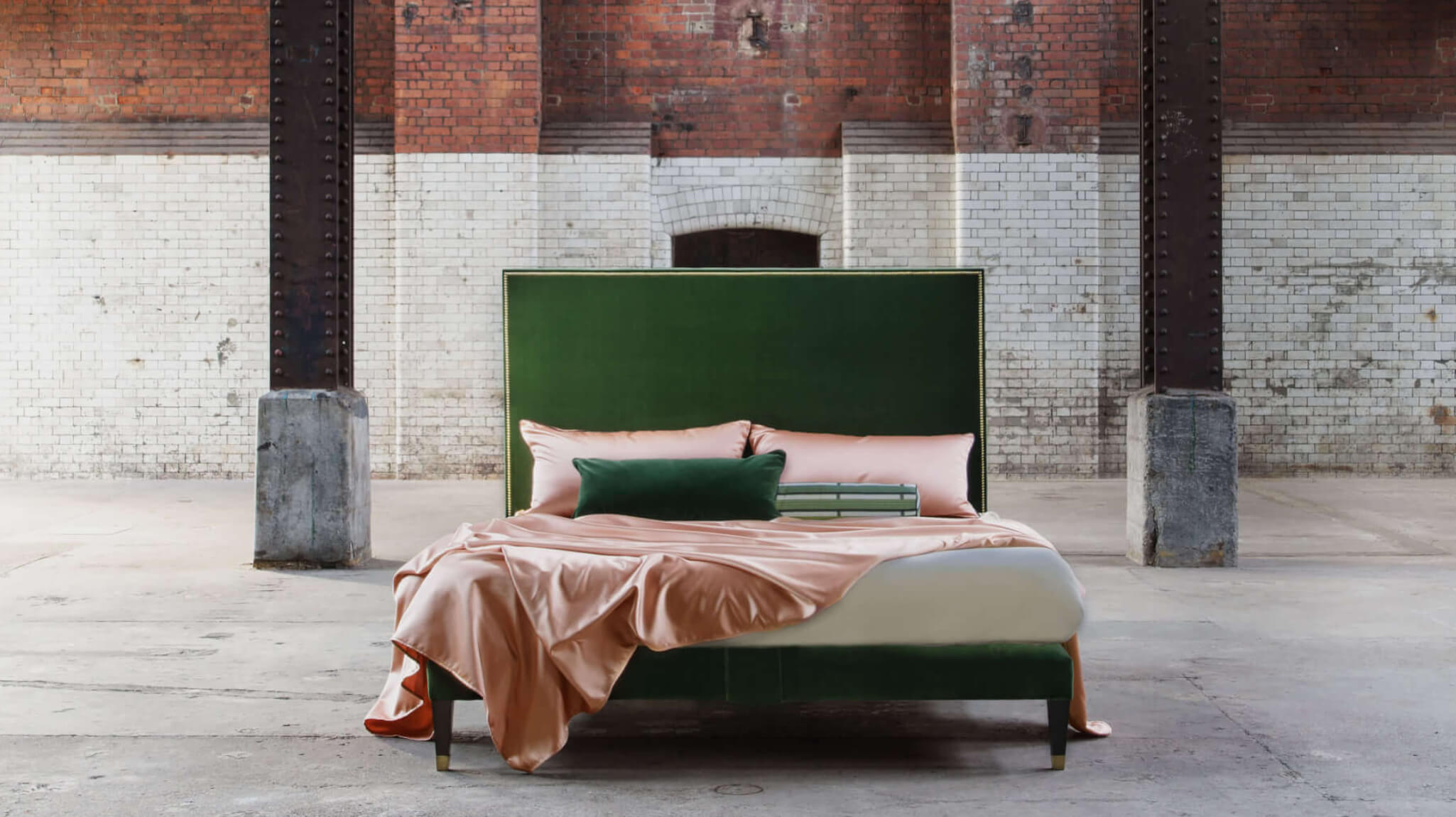 The Harlech headboard in rich green