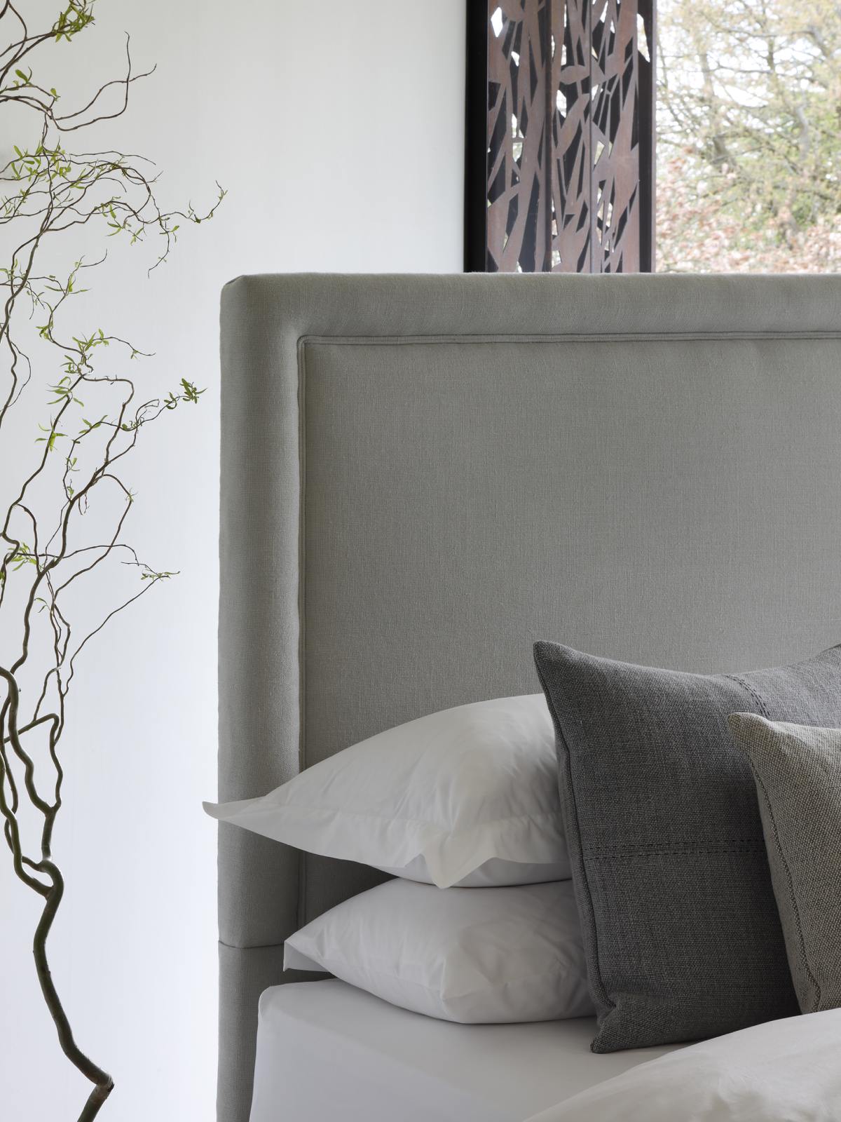 Savoir No4v bed made with plant-based ingredients and upholstered in natural grey linen