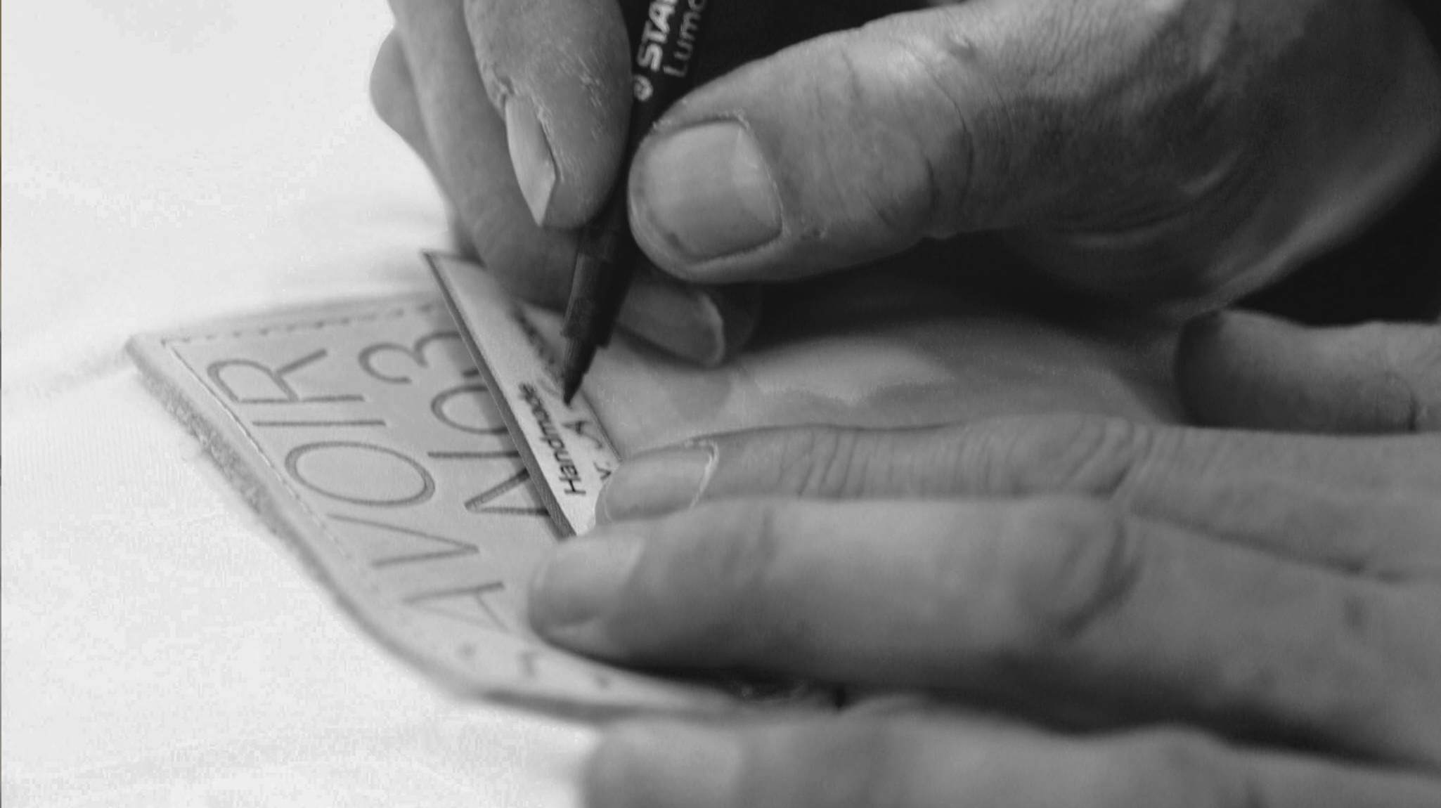 Savoir craftsman signing a mattress