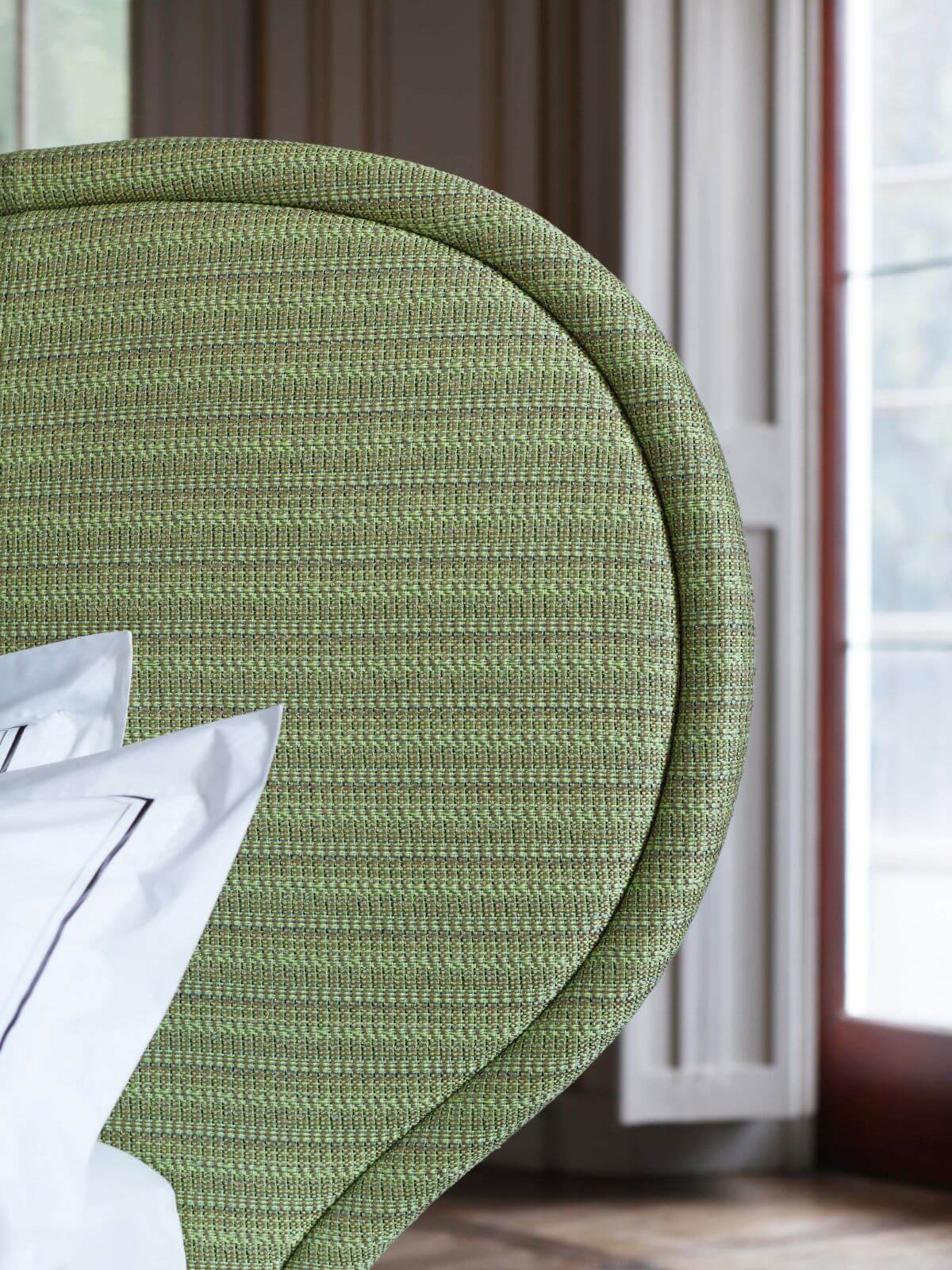 A close-up image of the Louis design, showcasing the intricate bright green tweed fabric by Francis Sultana.