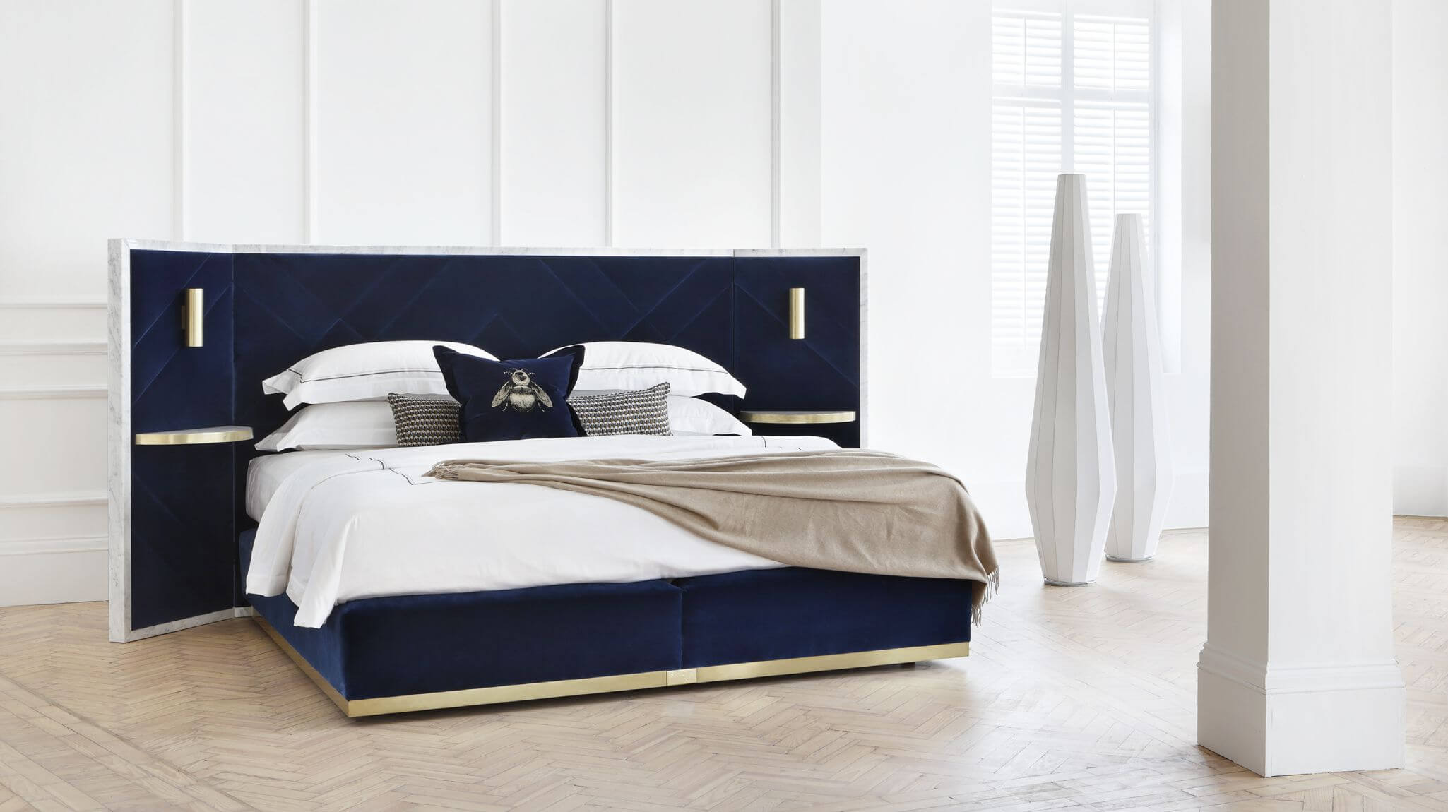 Image of our Rocco design, featuring marble elements and decadent deep blue velvet upholstery