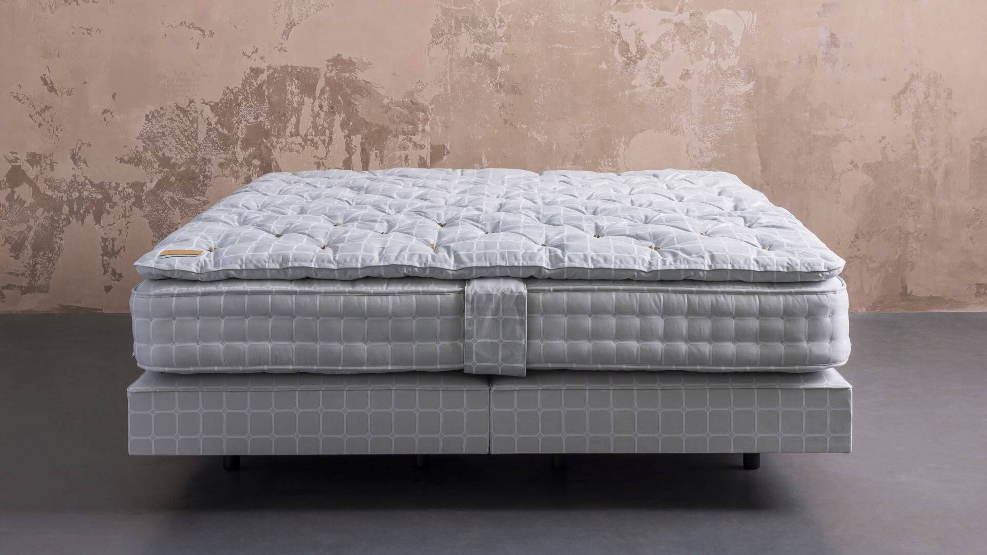 Savoir No5 bed featuring the CW topper, No5 mattress and base, all upholstered in signature blue ticking pattern.