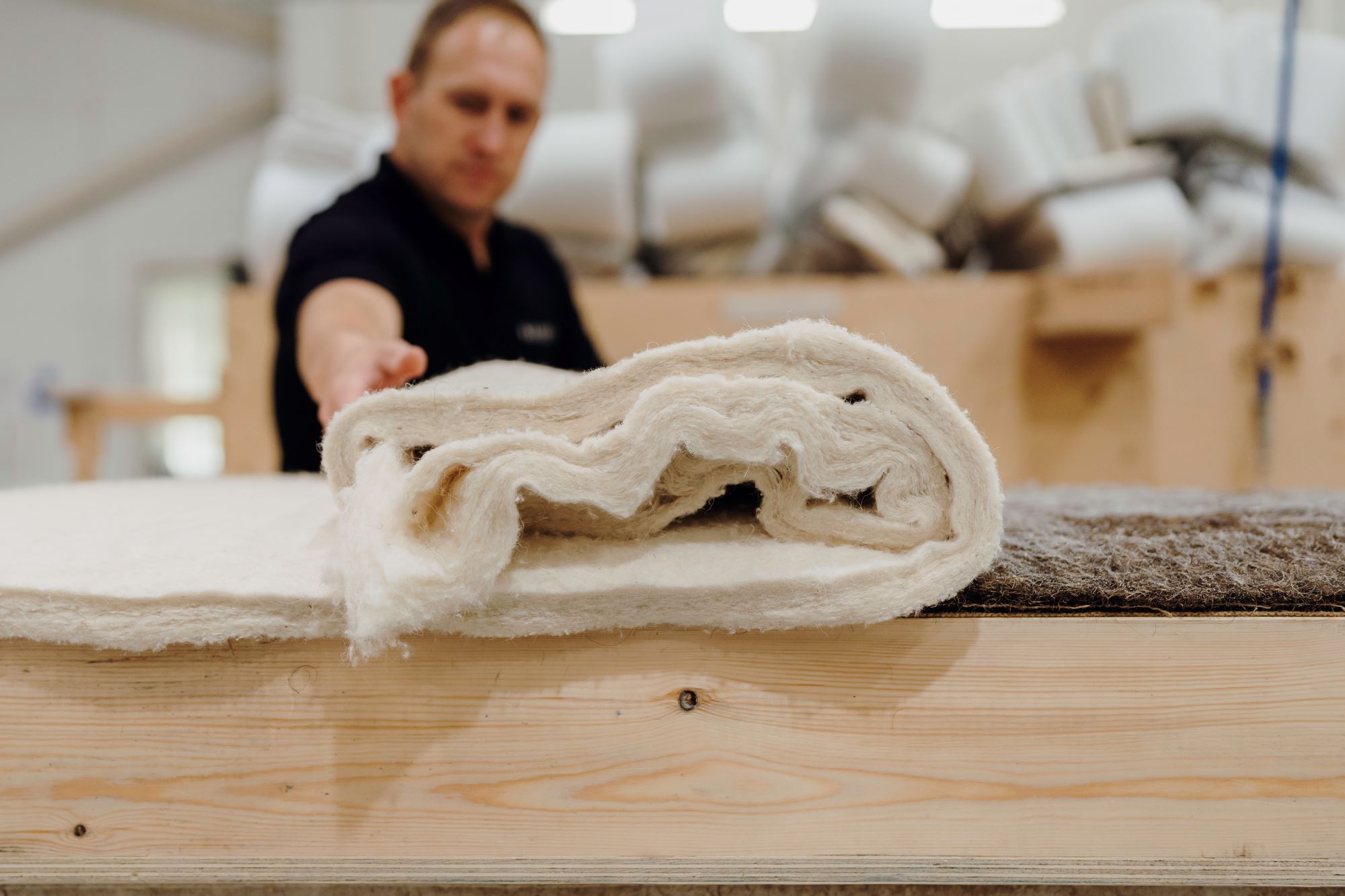 Image of a craftsman laying the natural base craft.