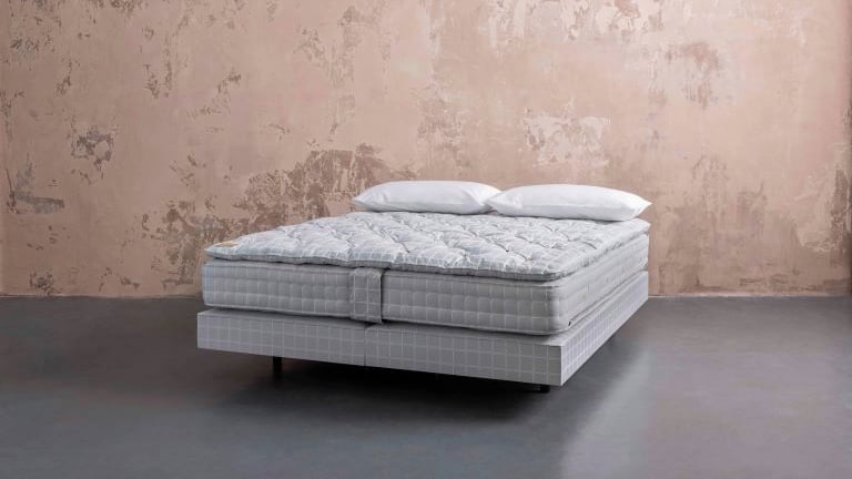 Handmade savoir no5 mattress and topper set against a pale pink rustic background