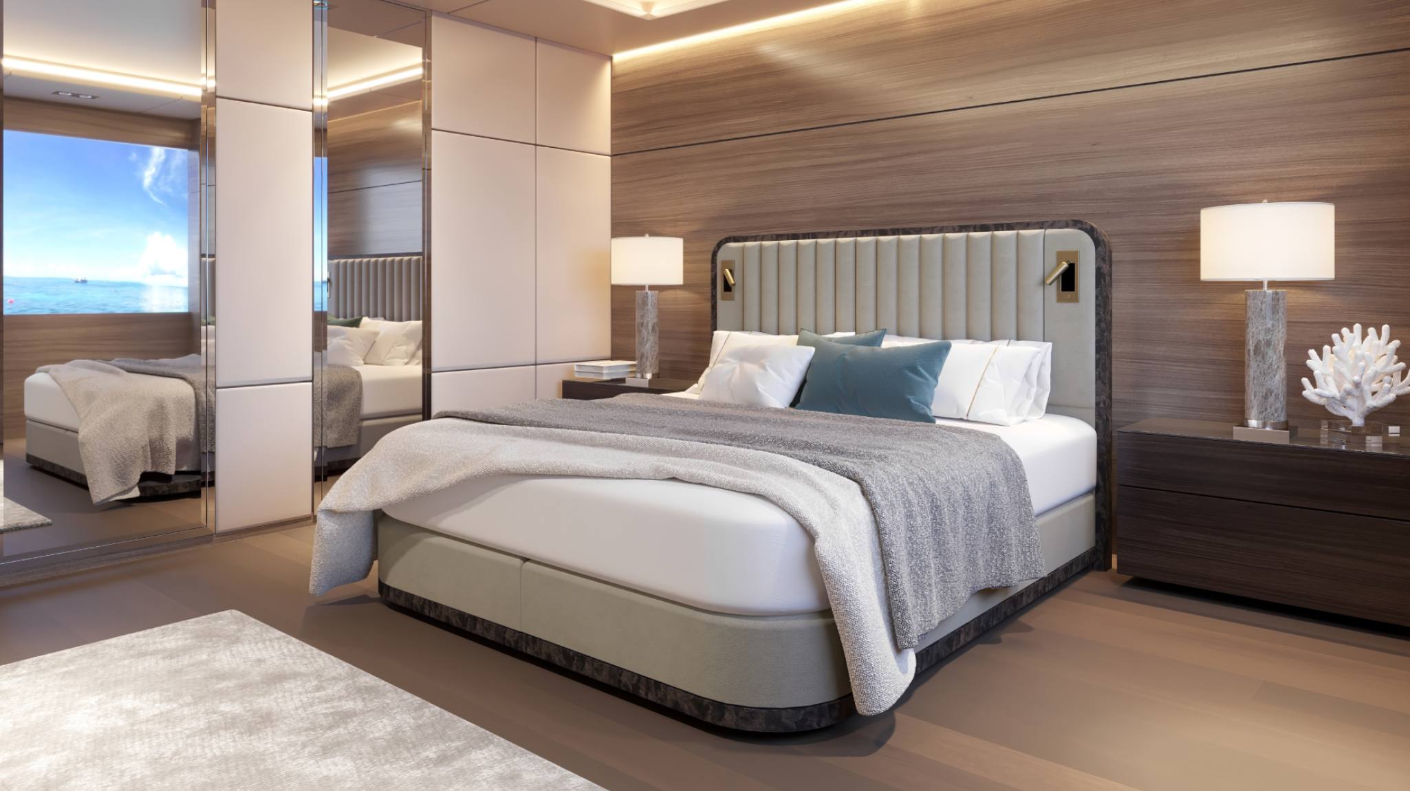 Savoir at Sea - the Luna bed presented against dark-wood interior of a yacht.